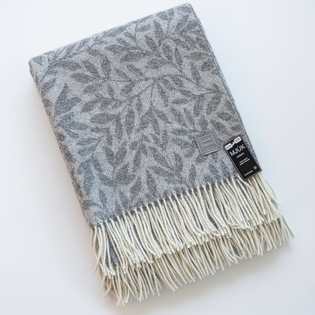 Gray patterned throw blanket with white fringe 